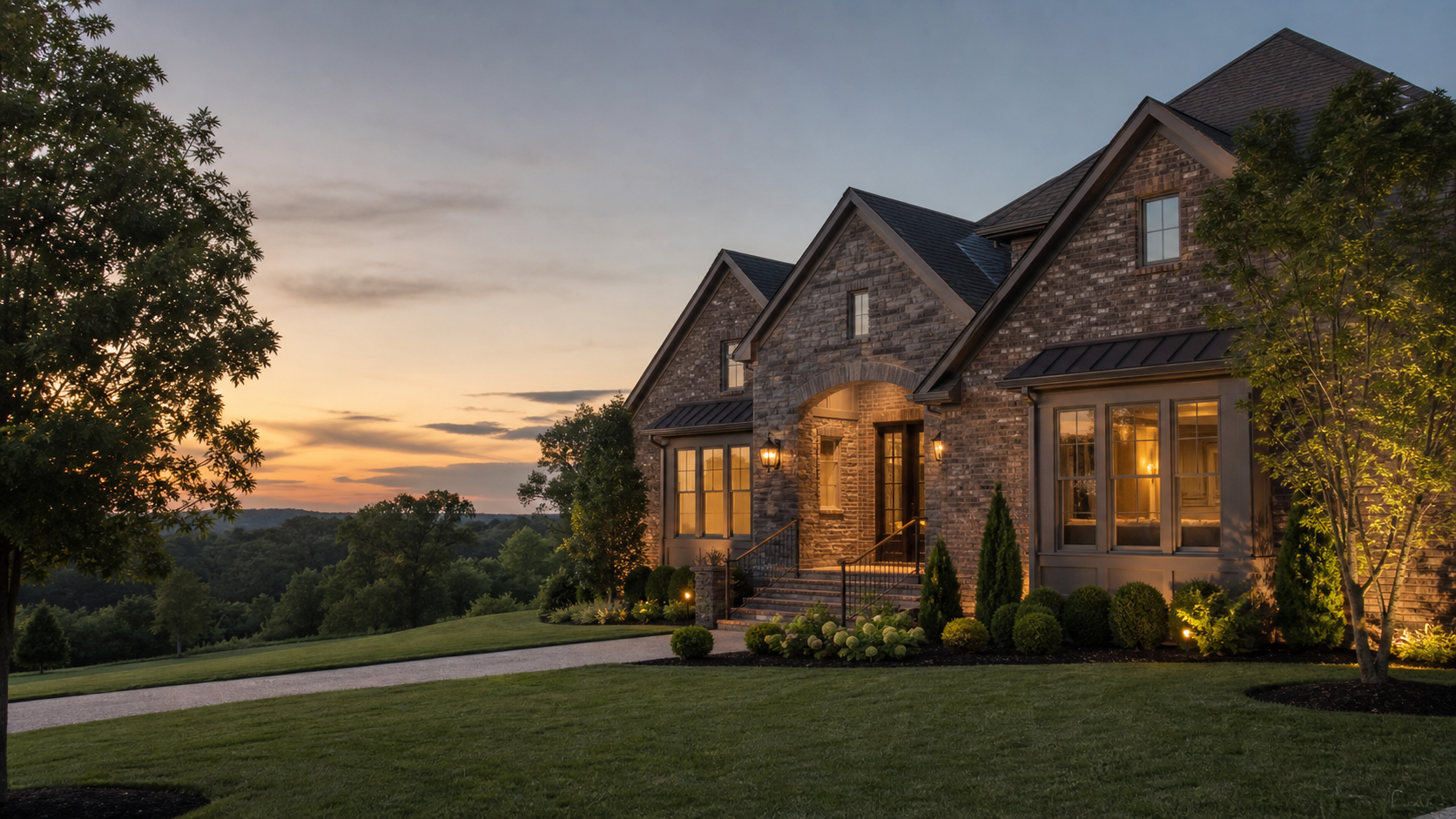 Upscale brick and stone home in Gallatin, Tennessee at sunset