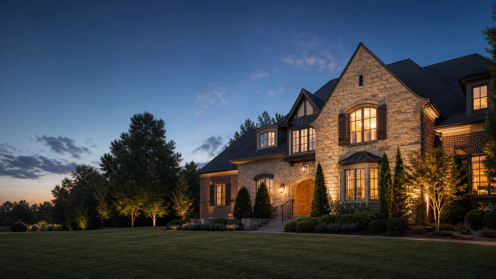Luxury brick and stone home in Gallatin, Tennessee at dusk